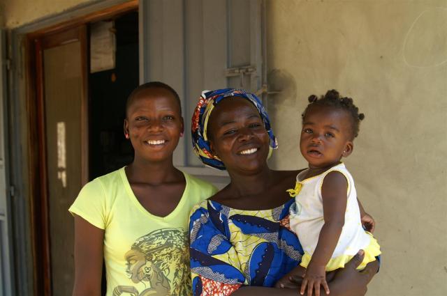 Assana (middle) today with her 2 daughters.